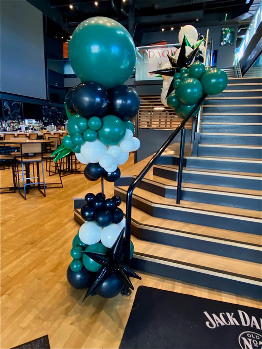 Balloon Column that is green, white, and black with starburst balloon accent.